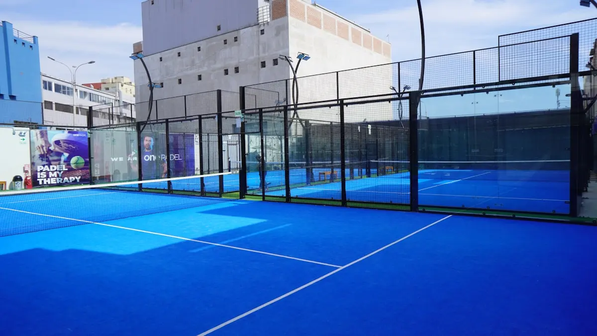 Blue padel courts in bright daylight