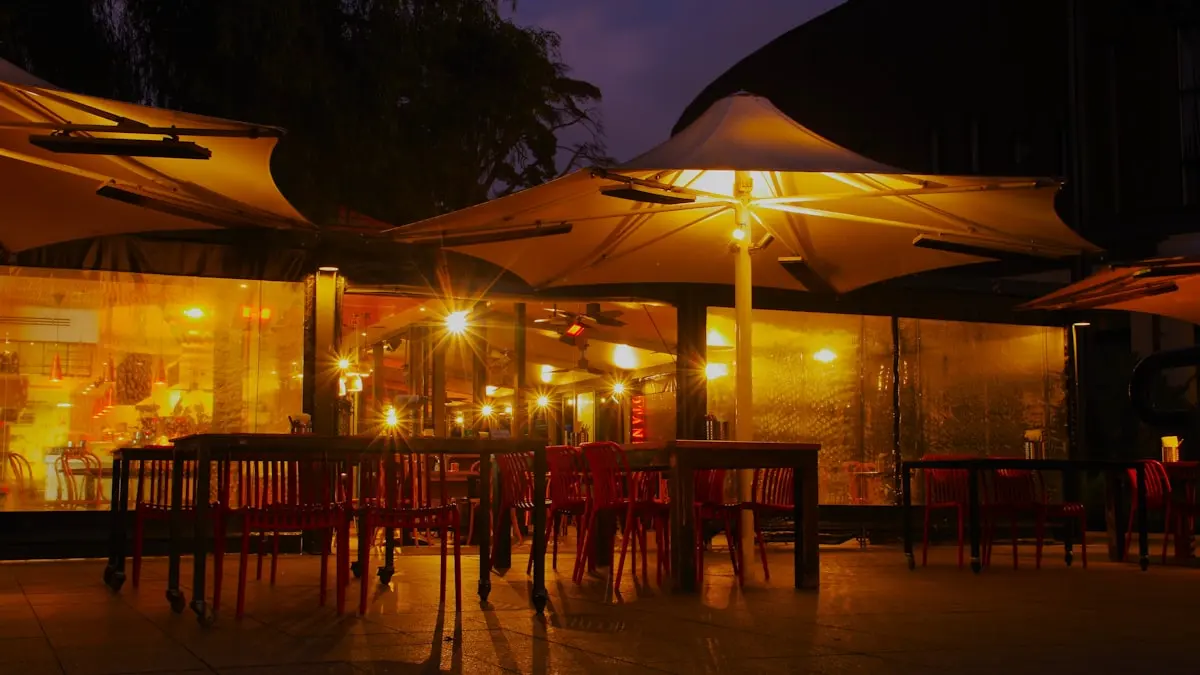 Warmly lit terrace seating at night